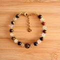 Pulsera Ojo de Tigre y Cuarzo Rutilado – Fuerza, Abundancia y Acción